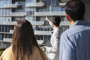 Real estate agents explaining contingencies in a property transaction